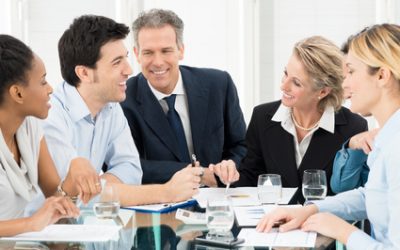 Portrait Of Happy Multiracial Businesspeople Discussing In Meeting